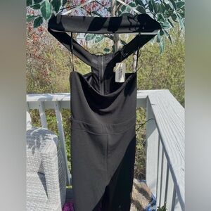 Night out one piece. With tube cut top with a hanging neck piece. Brand new😋